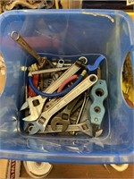Small plastic tub with tools and more
