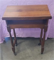 Vintage walnut library book stand on casters