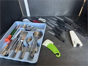 Blue tray of flatware and Wiltshire knives