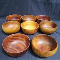 8 wooden bowls, one marked Georges Briard