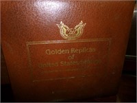 4 VOLUMES OF GOLD REPLICAS OF US STAMPS