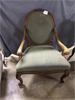Carved Chair with oval back and green upholstery-