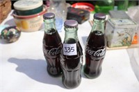 3 Coca Cola Bottles