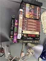 Lot VHS tapes and desk lamp