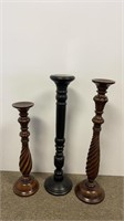 Three wooden candle pillars