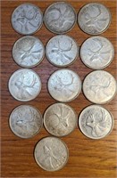 13 Canadian silver quarters, dates ranging from