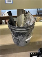 bucket of masonry tools,block hammer, trowels,