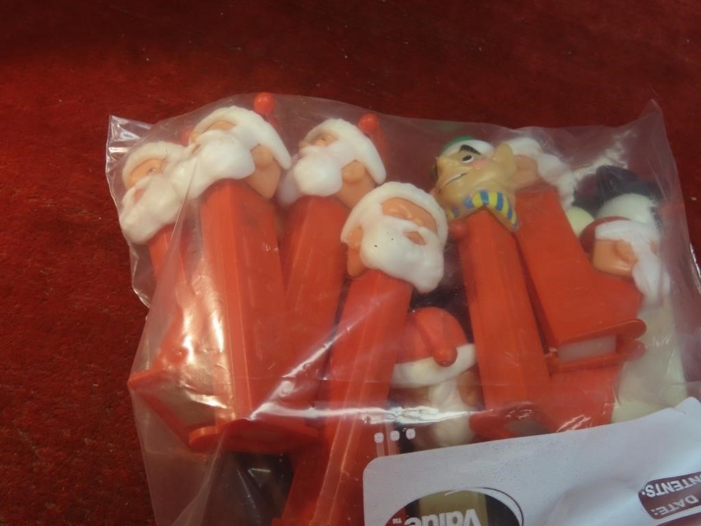 (16)Holiday themed Pez candy dispencer.