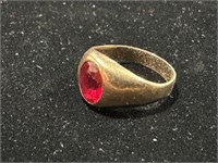 GOLD TONE RING WITH RED STONE