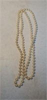Long strand of faux pearls approx 44 inches long