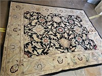 8 foot by 10 foot wool (?) indoor rug