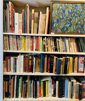 Four shelves of assorted books
