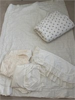Twin size comforters with a pair of dust ruffles