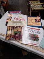 Assortment of cookbooks and how-to books