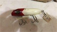 White red lure marked South Bend Bass-Oreno