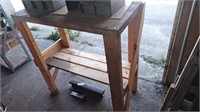 Wooden workbench.  Approximately 14x36x36. Bench