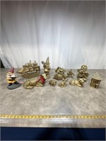 Assortment of gold painted gnomes, sail boat, and