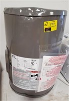 Small Rheem 10gal Elect Water Heater.  Dented on