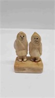 SMALL CARVED IVORY INUIT FIGURE