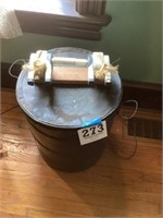 Large tin can and cow toilet paper holder