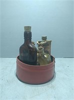 red tin of vintage medicine bottles