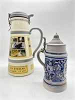 Two Vintage German Beer Steins with Lids