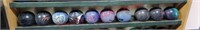 10 qty bowling balls on 3rd row