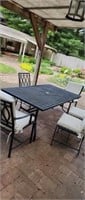 Cast patio table and 6 chairs with pads