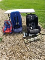 2 car seats in a baby doll stroller also a kids