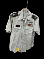 US military uniform shirt with service bars pins