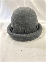 Felt hat - Has small decorations around the brim.