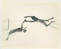 8x10 two male trapeze artists performing stunt