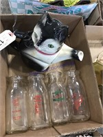 Cat pitcher, repaired, 4 half-pint milk bottles
