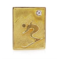 Diamond set 18ct yellow gold "Skier" pendant