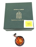 Sterling silver amber pendant, approx. 1.25" dia.,