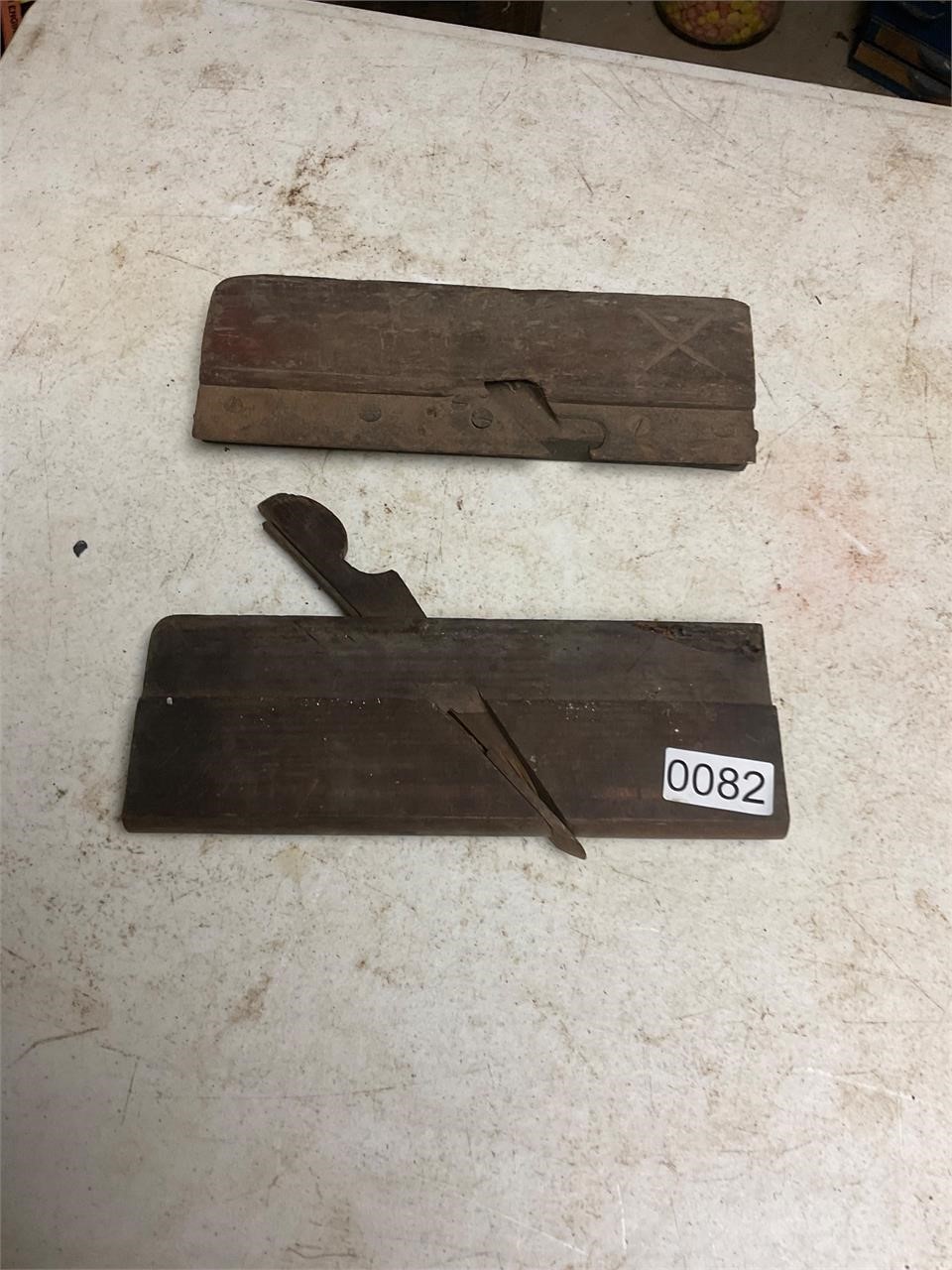 2= vintage wooden planes- one has blade