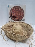 Aztec calendar and straw hat