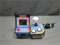 Two Handheld Pacman Video Games