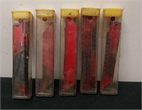 Five tubes with jigsaw blades