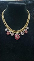 Gold tone pink stone ladies GUESS necklace