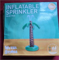 New in the box inflatable palm tree sprinkler