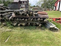 PILE OF WOODEN POSTS FOR FENCING