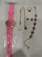 Woman's pink watch and  pink jewelry set