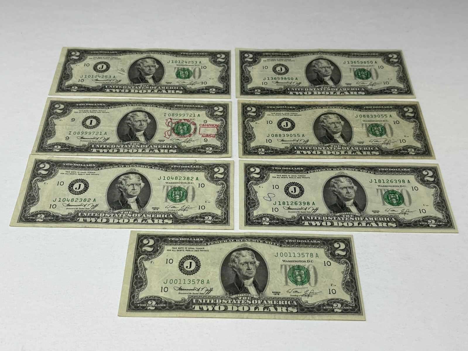Seven $2 US Bills