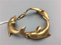 14 karat gold dolphin bracelet;