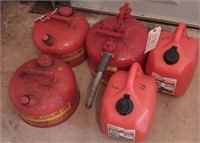 (3) metal gas cans and (2) two gallon plastic