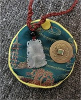 E- carved jade drop on cord, Chinese coin