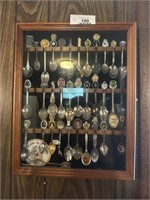 Vintage spoon collection in glass front case