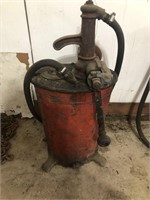 Antique calibrated circular crank oil dispenser.