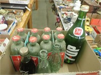 (11) Coca Cola Bottles / (1) Full + (1) 7-Up Bottl